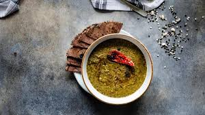 food culture “Traditional Garhwali Chainsoo made from roasted black gram, a smoky Uttarakhand staple.”